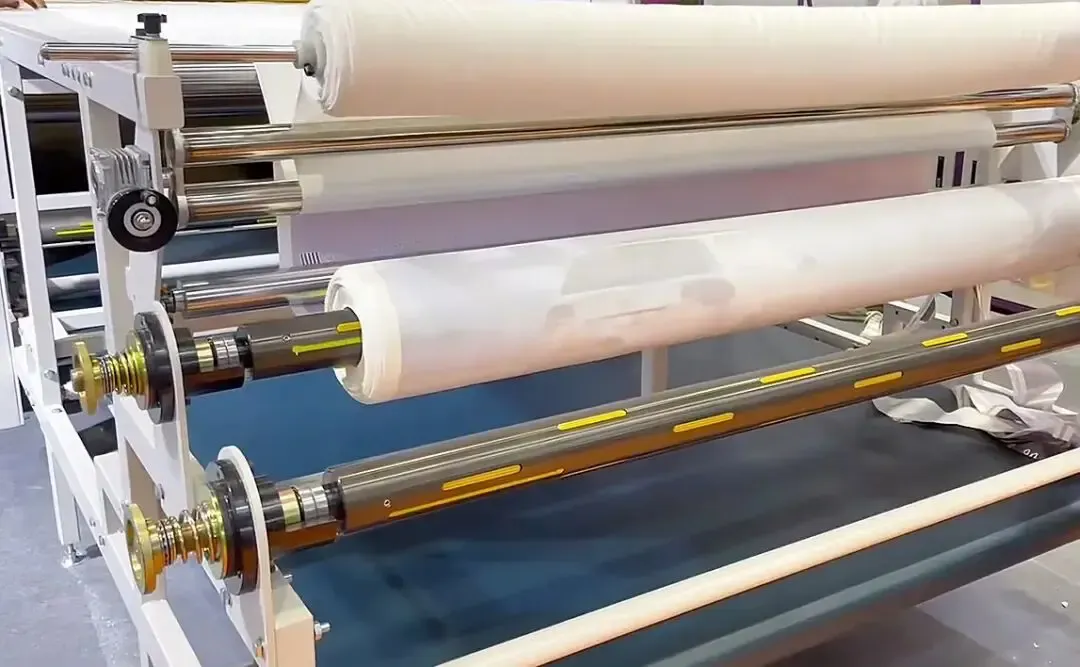 The roller machine in the factory is transferring thermal transfer paper