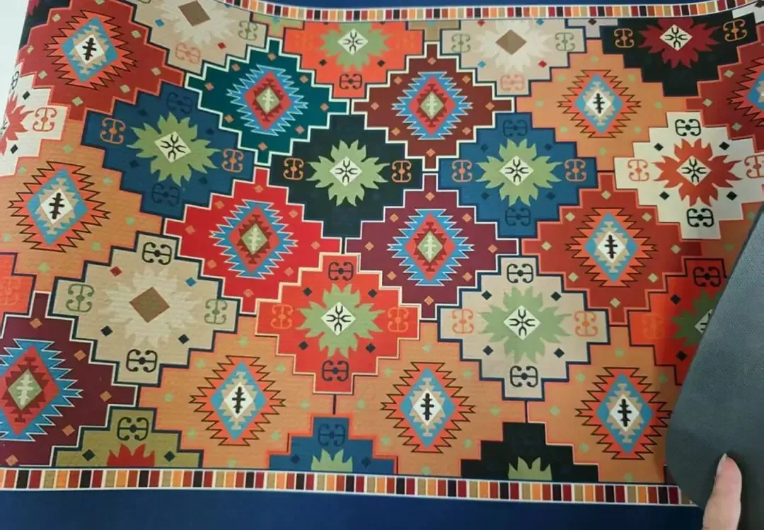 The display shows the floor mat samples printed by the Baosiwei dye sublimation printer.