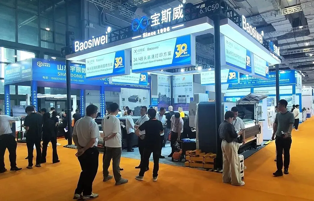 Baoswei spacious booth at DOMOTEX Asia 2026 showcasing 24-48 head high-speed digital printing solution attracting large crowd of industry visitors