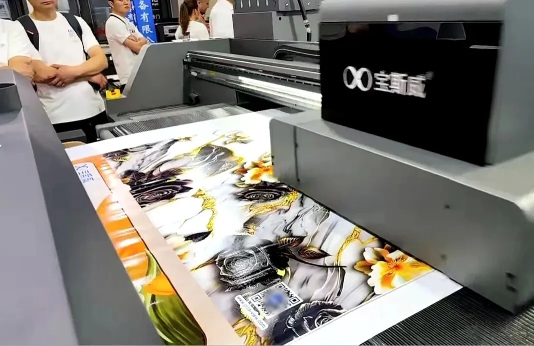 Baoswei flatbed printer producing large-format artwork with gold floral and black rose design — demonstrating high-definition color accuracy at DOMOTEX Asia