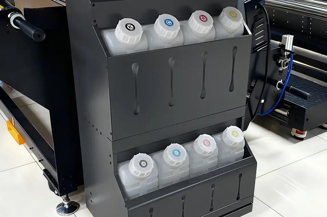 Close-up of high-capacity ink supply system, supporting long uninterrupted production, preventing ink interruptions, and ensuring color consistency across prints