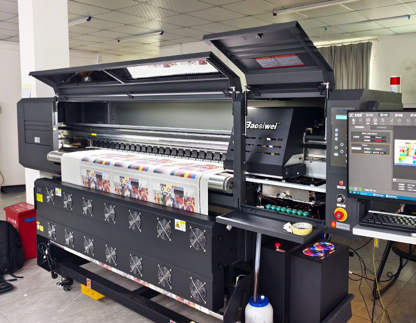 This is a photo of a Baosiwei 1.8-meter digital textile printer in operation at the production facility.