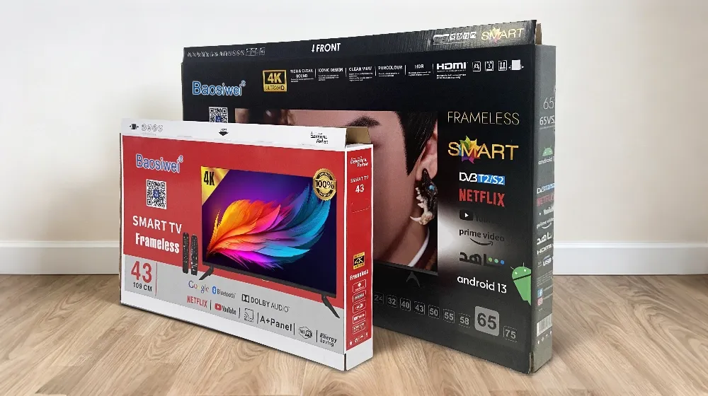 Finished Baosiwei digital printed TV packaging boxes — two sizes in red-white and black-white color schemes with detailed product graphics demonstrating premium color box quality