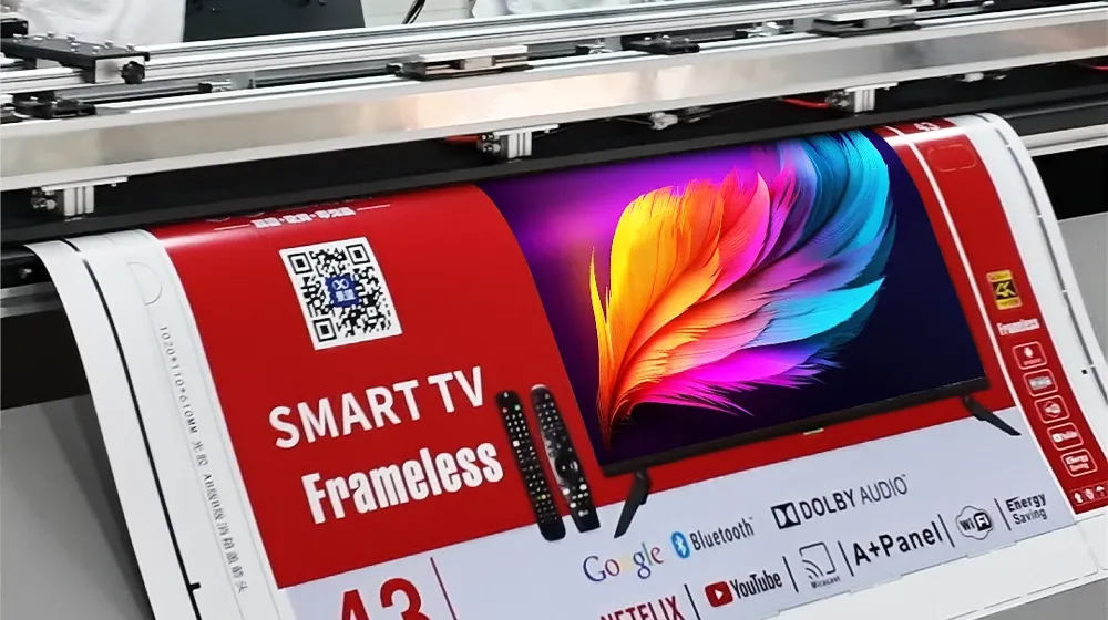Baosiwei automatic cutting unit — printed TV box sheets with color feather artwork QR codes and feature icons being precision cut with tungsten steel blade within 1mm accuracy