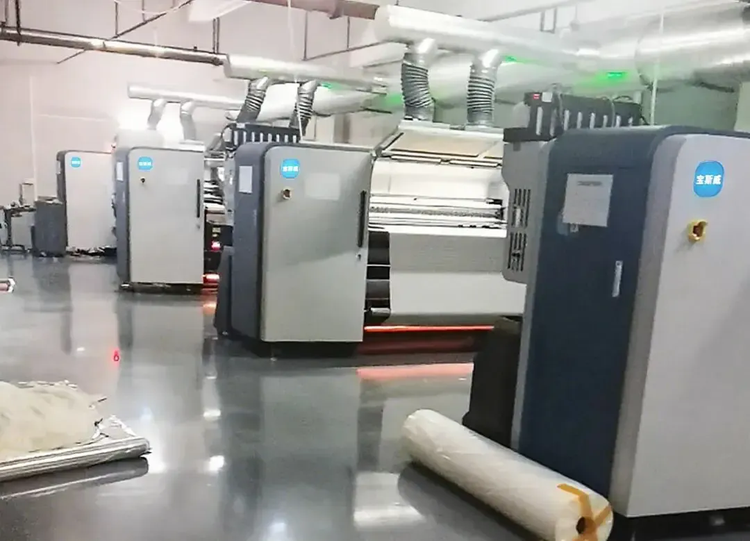 Four Baosiwei 16-head eco-solvent printers in tablecloth factory for smart mass production