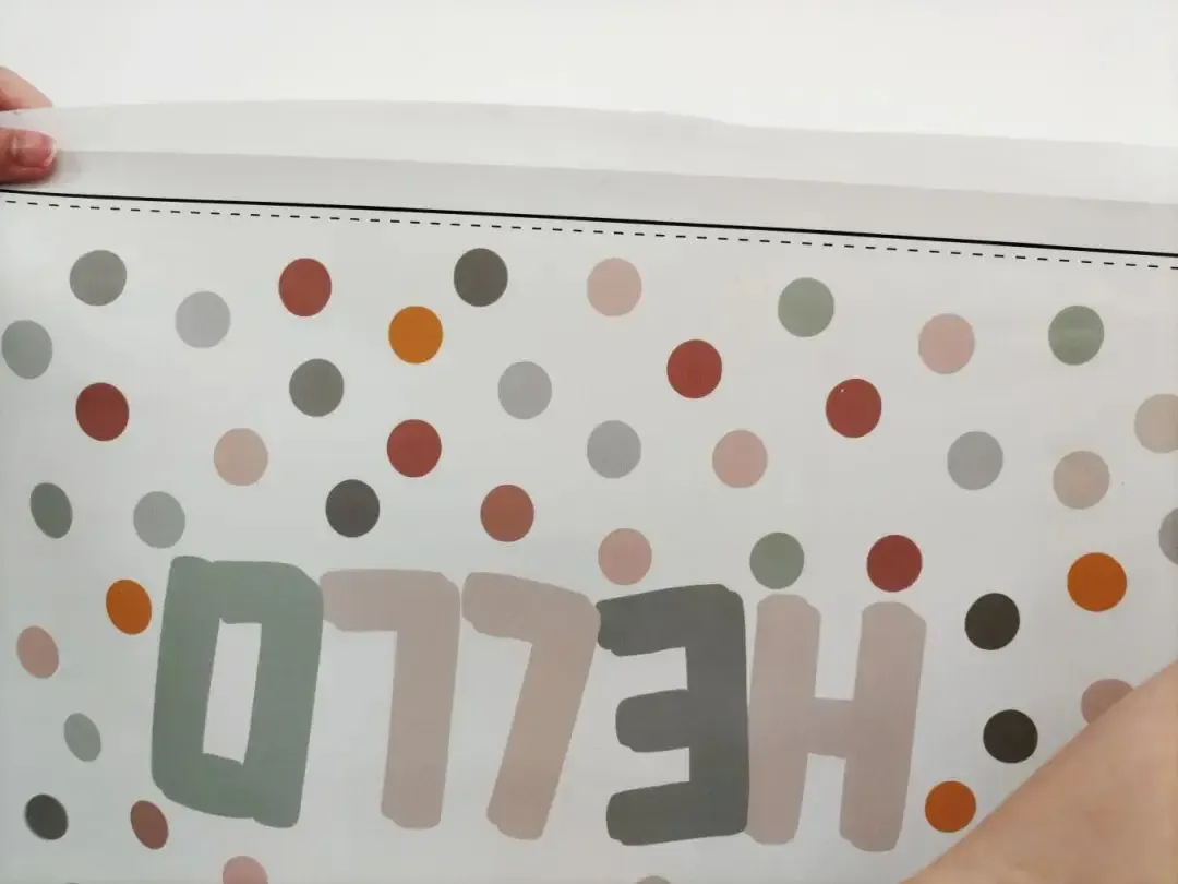 Baosiwei technician showcasing a tablecloth sample printed with Baosiwei eco-solvent ink – vibrant colors and clear patterns deeply absorbed into the fabric fibers