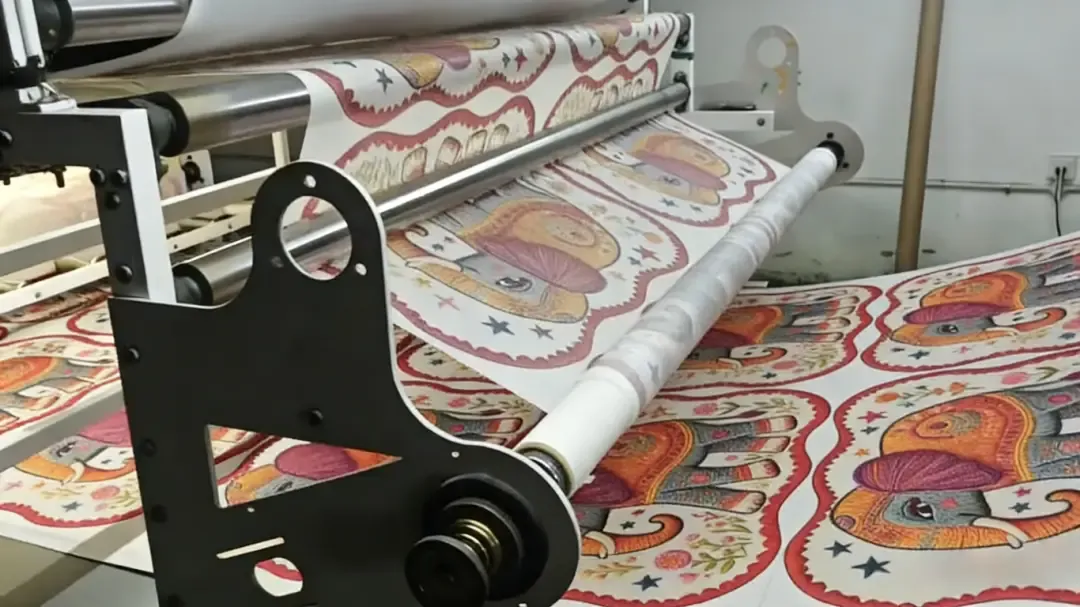 Roller machine transfer operation scene, transferring the colorful elephant-patterned design from transfer paper onto a floor mat; the finished mat via this process has bright colors, soft hand feel and firmly penetrated patterns.